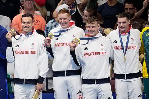 Britain's gold medal winners in men's 4x200-meter freestyle relay team